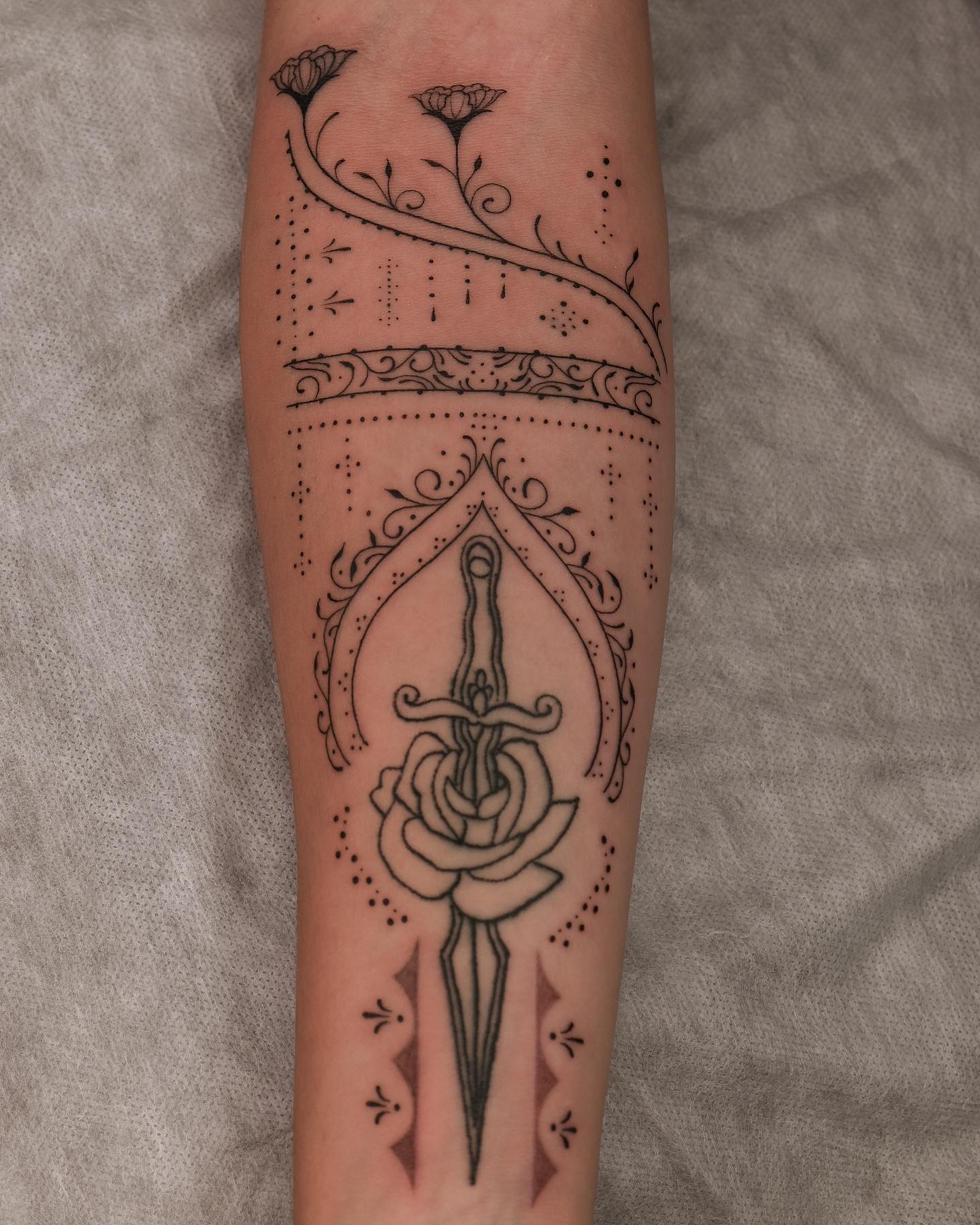 Ornamental linework piece by Chetana at Beach Park Tattoo