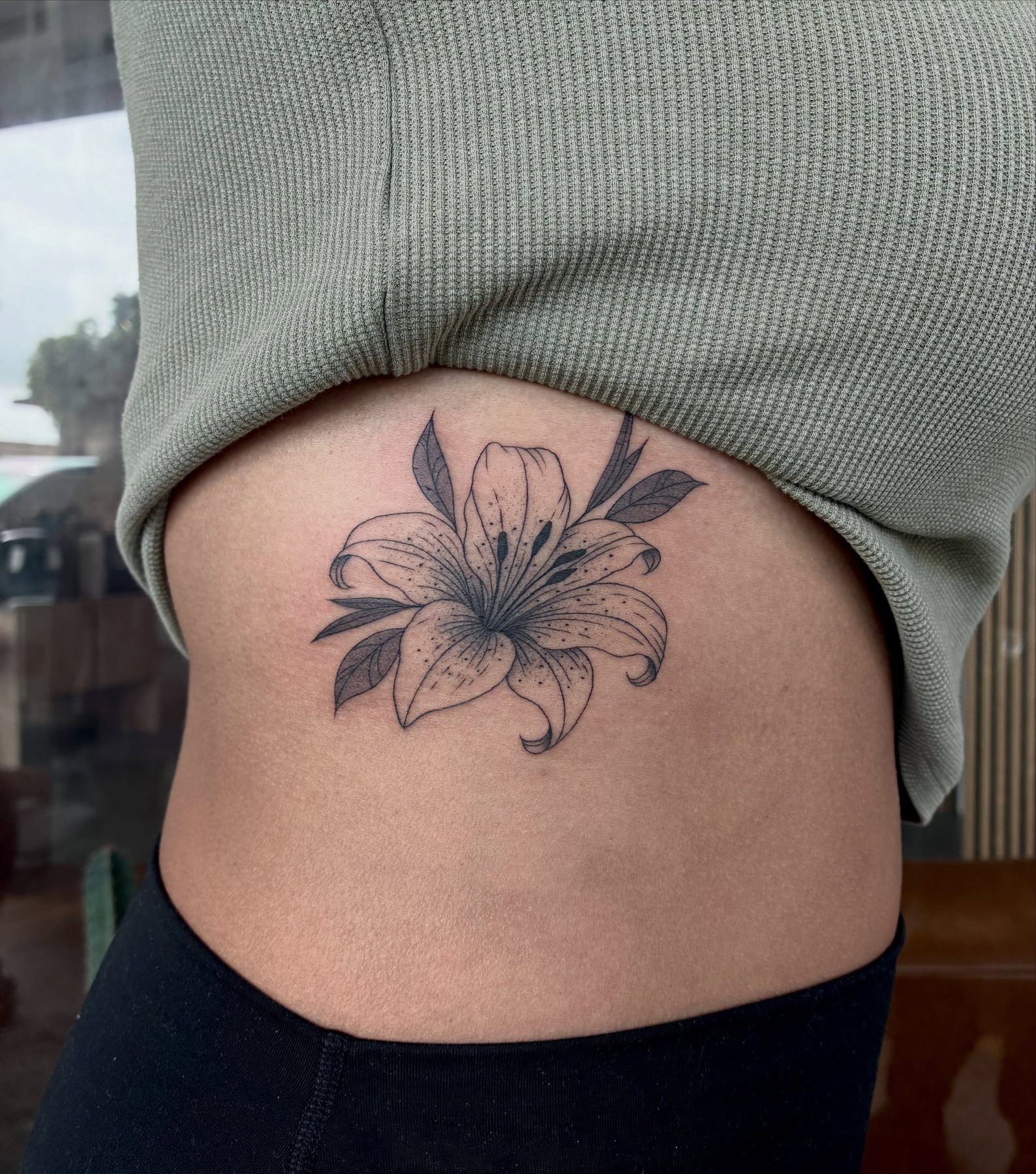 Lily tattoo work at Beach Park Tattoo Kailua