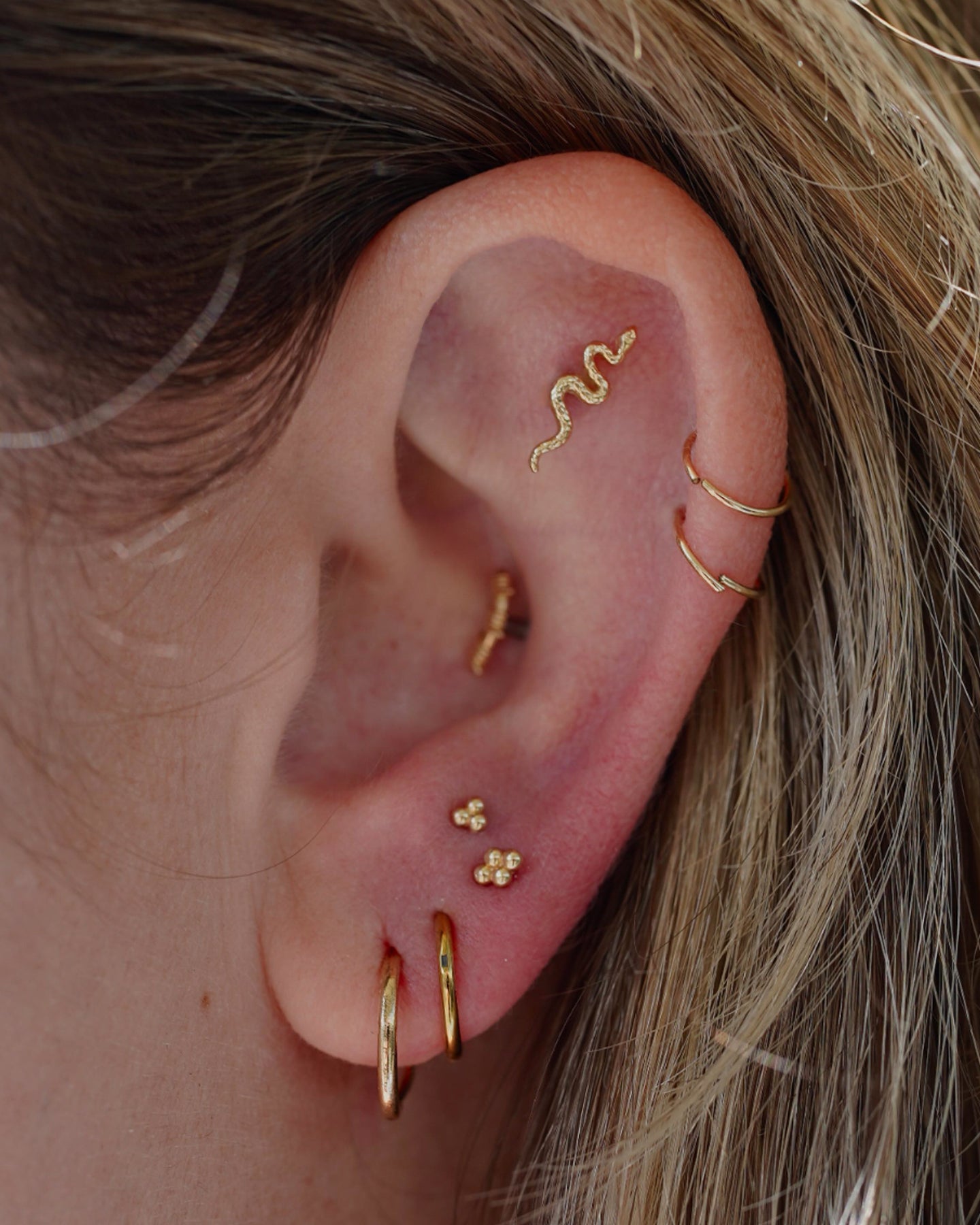 Curated ear stack by Maddie at Beach Park Tattoo Kailua